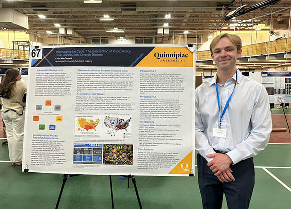 nursing student presenting their capstone project at the quinnipiac symposium