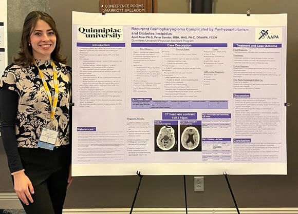Student presenting her poster at a ConnAPA conference
